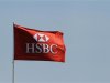 A HSBC flag flutters in Singapore