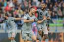 Marseille's French Andre-Pierre Gignac, center, celebrates with teammate Alexy Romao after scoring the winning goal during their League One soccer match against Caen, in Caen, western France, Saturday, Oct. 4, 2014. Marseille won 2-1. (AP Photo/David Vincent)