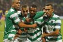 Sporting's Nani, center, celebrates his goal with his teammates during the Champions League Group G soccer match between Maribor and Sporting, in Maribor, Slovenia, Wednesday, Sept. 17, 2014. (AP Photo/Darko Bandic)