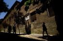 FILE - In this July 28, 2011 file photo, pedestrians walk by the closed order convent of the Trinitarias Descalzas, where the Spanish writer Miguel de Cervantes, author of 