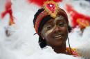 The Notting Hill Carnival, an annual two-day event, Europe's biggest street party, snakes through the streets on a five-kilometre parade route featuring steel bands and dancers in exotic carnival costumes, watched by crowds of revellers