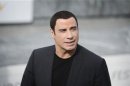 U.S. actor Travolta poses during a photocall to promote the film Savages on the third day of the San Sebastian Film Festival