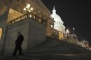 A member of the U.S. House of Representatives walks down the steps from the House Chamber as he exits the U.S. Capitol in Washington