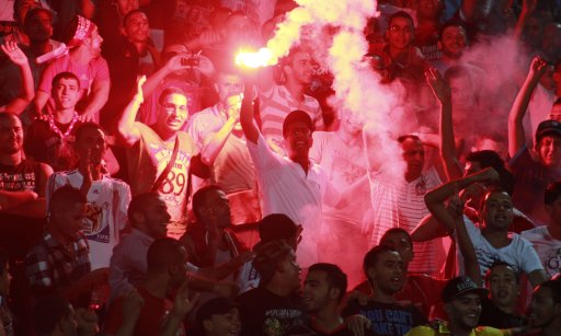 Fans of Etoile Sportive du Sahel light flares during their African Champions League soccer match against Esperance Sportive de Tunis at the Sousse Olympic stadium