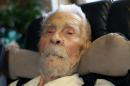 Imich, the world's oldest living man, poses for a photograph during an interview with Reuters at his home on New York City's upper west side