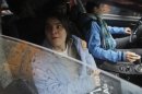 Yekaterina Samutsevich, a member of the female punk band "Pussy Riot", sits in a car after she was freed from the courtroom in Moscow