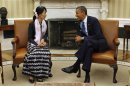 U.S. President Obama speaks with Myanmar opposition leader Suu Kyi during their meeting in the White House