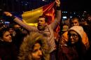 A man shouts a slogan during a protest against Romanian prime minister and presidential candidate Victor Ponta on November 14, 2014, in Bucharest
