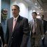 Speaker of the House John Boehner, R-Ohio, walks to a closed-door GOP caucus as Congress meets to negotiate a legislative path to avoid the so-called "fiscal cliff" of automatic tax increases and deep spending cuts that could kick in Jan. 1., at the Capitol in Washington, Sunday, Dec. 30, 2012. (AP Photo/J. Scott Applewhite)