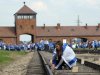 Young Jews place memory plaques on railway tracks at the Auschwitz-Birkenau Nazi death camp in April