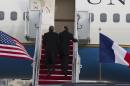 President Barack Obama and French President Francois Hollande walk up the stairs before boarding Air Force One at Andrews Air Force Base, Md., Monday Feb. 10, 2014, for a trip to visit Thomas Jefferson's Monticello in Charlottesville, Va. ( AP Photo/Jose Luis Magana)