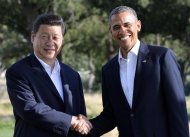 US President Barack Obama shakes hands with Chinese President Xi Jinping before their bilateral meeting at the Annenberg Retreat at Sunnylands in Rancho Mirage, California, on June 7, 2013. Obama and Xi opened their crucial first summit, calling for a new approach to relations between the US superpower and China, the rising giant