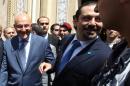 Former Lebanese premier Saad Hariri (C-R) and current Prime Minister Tammam Salam (C-R) meet at the governmental palace in Beirut on August 8, 2014