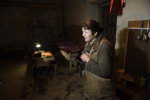 A woman stands in the cellar of her building, often &hellip;