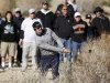 Mahan of the U.S. hits out of the bushes on the 17th hole during the championship match of the WGC-Accenture Match Play Championship golf tournament in Marana