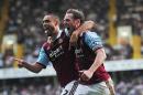 West Ham United's New Zealand defender Winston Reid (L) celebrates scoring the opening goal with English midfielder Kevin Nolan (R) at White Hart Lane in London on October 6, 2013