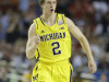 Michigan guard Spike Albrecht (2) reacts against the Louisville during the first half of the NCAA Final Four tournament college basketball championship game Monday, April 8, 2013, in Atlanta. (AP Photo/Charlie Neibergall)