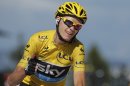 Christopher Froome of Britain, wearing the overall leader's yellow jersey, flashes a thumbs up and a big smile as crosses the finish of the 20th stage of the Tour de France cycling race over 125 kilometers (78.1 miles) with start in in Annecy and finish in Annecy-Semnoz, France, Saturday July 20 2013. (AP Photo/Peter Dejong)