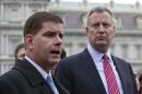 New York Mayor-elect Bill de Blasio and Boston Mayor-elect Martin Walsh speak to the press outside the West Wing of the White House in Washington