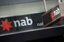 National Australia Bank announced plans Thursday to raise Aus$5.5 billion (US$4.4 billion) in capital and demerge its British banking business as it posted a 20.4 percent jump in half-year net profit