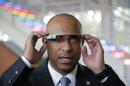 Haiti's Prime Minister Laurent Lamothe wears Google Glass during a demonstration and tour at the Google headquarters complex Wednesday, Nov. 20, 2013, in Mountain View, Calif. From Google to Facebook to Apple, Lamothe plans to spend Wednesday on a whirlwind tour through Silicon Valley's most elite tech campuses, hoping to convince some of the world's wealthiest and most successful corporate executives to share support and innovation with the poorest country in the Americas. Lamothe joins a growing stream of politicians, celebrities and CEOS taking these popular roadshows where they do a little business, a little schmoozing and quite a bit of questioning about how innovation happens in this booming tech region. (AP Photo/Eric Risberg)