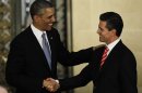 U.S. President Obama shakes hands with his Mexican counterpart Pena Nieto after a news conference and a bilateral meeting in Mexico City