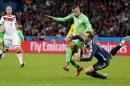 Germany's goalkeeper Manuel Neuer, right, clears the ball from Algeria's Islam Slimani during the World Cup round of 16 soccer match between Germany and Algeria at the Estadio Beira-Rio in Porto Alegre, Brazil, Monday, June 30, 2014. (AP Photo/Frank Augstein)