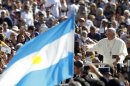 Pope Francis waves to faithful as he arrives for his weekly general audience in St. Peter's Square at the Vatican, Wednesday, Sept. 18, 2013. At left, a faithful waves an Argentine flag. (AP Photo/Riccardo De Luca)
