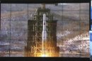 In this image made from video, displays show the Unha-3 rocket launch at North Korea's space agency's General Launch Command Center on the outskirts of Pyongyang, Wednesday, Dec. 12, 2012. The rocket launch will enhance the credentials of 20-something leader Kim Jong Un at home a year after he took power following the death of his father Kim Jong Il. It is also likely to bring fresh sanctions and other punishments from the U.S. and its allies, which were quick to condemn the launch as a test of technology for a missile that could attack the U.S. mainland. Pyongyang says it was merely a peaceful effort to put a satellite into orbit. (AP Photo via APTN)