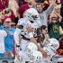 Oregon running back Kenjon Barner, top, celebrates with teammates after scoring during the first half of an NCAA college football game against Southern California, Saturday, Nov. 3, 2012, in Los Angeles. (AP Photo/Bret Hartman)