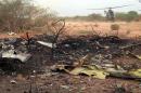 This photo provided Friday July 25, 2014 by the French army shows a helicopter at the site of the plane crash in Mali. French soldiers secured a black box from the Air Algerie wreckage site in a desolate region of restive northern Mali on Friday, the French president said. Terrorism hasn't been ruled out as a cause, although officials say the most likely reason for the catastrophe that killed all onboard is bad weather. At least 116 people were killed in Thursday's disaster, nearly half of whom were French. (AP Photo/ECPAD)