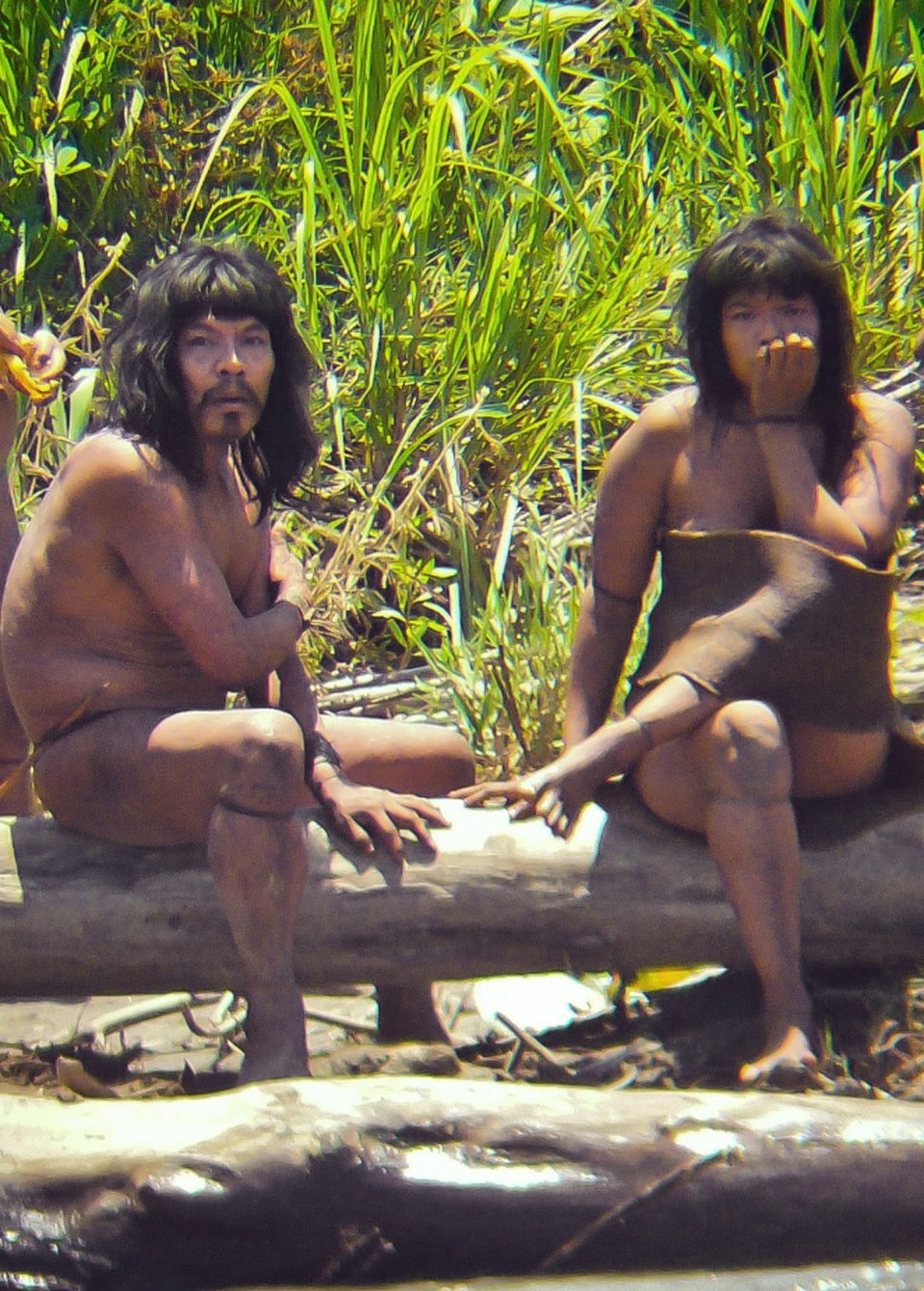 FILE - This Nov. 2011 file photo, shows members of the Mashco-Piro tribe, photographed at an undisclosed location near the Manu National Park in southeastern Peru. More than 100 Mashco-Piro appeared across a river from the remote community of Monte Salvado in Madre de Dios state, says Klaus Quicque the president of the regional FENAMAD indigenous federation on Monday, Aug. 19, 2013. The Maschco-Piro first appeared in May 2011 after more than two decades in voluntary isolation. (AP Photo/Diego Cortijo, Survival International, File)