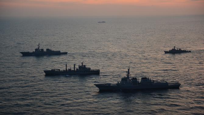 This handout photo released by South Korea Joint Chiefs of Staff on February 4, 2013 shows South Korean and US warships during a joint naval exercise in the East Sea
