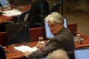Former Bosnian Serb leader Radovan Karadzic looks back during a trial in a courtroom of the International Criminal Tribunal (ICTY) for the former Yugoslavia