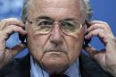 FILE - In this June 1, 2011 file photo, the then FIFA President Sepp Blatter adjusts his headphones during a press conference after the 61st FIFA Congress in Zurich, Switzerland. Sepp Blatter says it was "not acceptable" to be accused at a public event Friday April 15, 2016 that he stayed silent while likely knowing that senior FIFA officials were corrupt. (AP Photo/Michael Probst, file)