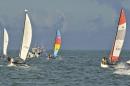 In this photo provided by the Florida Keys News Bureau, Hobie Cat sailboats and support boats head towards Havana after departing Key West, Fla., Saturday, May 16, 2015. Five 16-foot-long Hobie Cats are participating in the the Havana Challenge, believed to be the first U.S. government-sanctioned sailing race between Key West and Cuba in more than 50 years. (Bert Budde/Florida Keys News Bureau via AP)