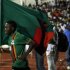 Zambia's Emmanuel Mayuka runs with Zambia flag as he celebrates their victory in the African Nations Cup final against Ivory Coast in Libreville