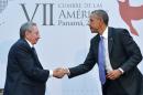 US President Barack Obama (R) shakes hands with Cuba's President Raul Castro (L) on the sidelines of the Summit of the Americas on April 11, 2015 in Panama City