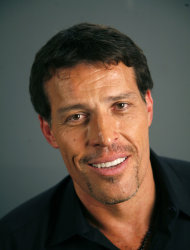 FILE - Tony Robbins poses for a portrait Monday, July 26, 2010 in New York. Fire officials in California say at least 21 people were treated for burns after attendees of an event for motivational speaker Tony Robbins tried to walk on hot coals. (AP Photo/Jeff Christensen, File)