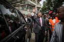 Gabonese opposition leader Jean Ping greets his supporters outside his party headquarters in Libreville on August 28, 2016