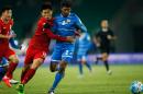 Jiang Ning of China (C) competes for the ball with Ali Samooh (R) of Maldives during their 2018 World Cup football qualifying match in Wuhan on March 24, 2016