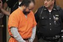 Ariel Castro walks into the court room with his head down for a pre-trial hearing on charges including rape, kidnapping and murder in Cleveland
