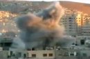 This image taken from video obtained from Ugarit, which has been authenticated based on its contents and other AP reporting, shows an explosion during heavy fighting between rebels and Syrian government forces in the Barzeh district of Damascus, Syria, Friday, April 26, 2013. On the streets of Damascus, the two-year old conflict dragged on Friday, with government troops pushing into two northern neighborhoods, triggering heavy fighting with rebels as they tried to advance under air and artillery support, activists said. The Britain-based Syrian Observatory for Human Rights said the fighting between rebels and soldiers backed by pro-government militiamen was concentrated in the Jobar and Barzeh areas.(AP Photo/Ugarit via AP video)