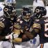 Chicago Bears linebacker Brian Urlacher (54) celebrates with Israel Idonije (71) and Nick Roach (53) after he recovered fumble against the Detroit Lions near the goal line in the second half of an NFL football game in Chicago, Monday, Oct. 22, 2012. (AP Photo/Kiichiro Sato)
