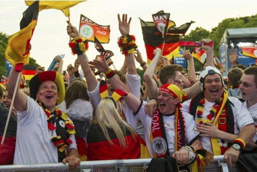 Fans celebrate after Germany scored against Netherlands during their Euro 2012 soccer match, at the Fan Mile in Berlin