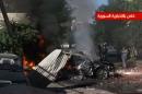 An image grab from Syrian state TV on October 15, 2013, said to show wreckage of a car following shelling by rebel fighters on Damascus' Dummar district where the Syrian President attended a prayer for Eid al-Adha