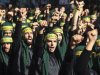 Lebanon's Hezbollah supporters gesture as they march during a ceremony to mark Ashura in Beirut's suburbs