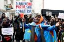 A demonstrator holds a sign during a protest against Democratic Republic of Congo's President Kabila in central Brussels