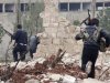 Free Syrian Army fighters run during clashes with forces loyal to Syria's President Bashar al-Assad in Ouwayjah village in Aleppo