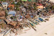 An aerial shot shows devastation in the aftermath in the aftermath of Super Typhoon Haiyan that smashed into coastal communities on the central Philippines in Iloilo on November 9, 2013